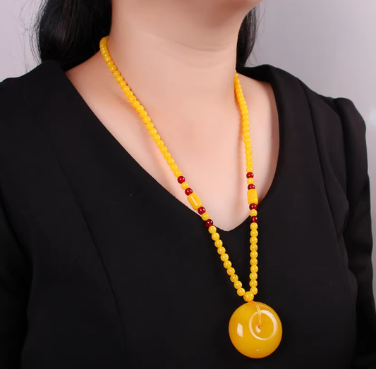 Guardian of Earth – Baltic Golden Beeswax Amber Peace Knot Pendant Necklace