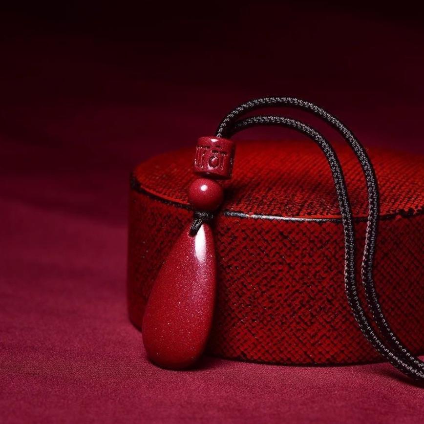 Cinnabar Teardrop Pendant: The Fire of Protection, The Flow of Fortune