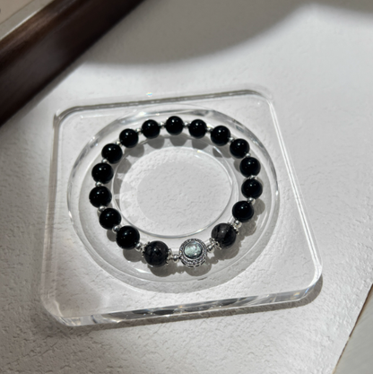 Aqua Fortune Guardian – Black Obsidian & Rutilated Quartz Bracelet with Aquamarine Center